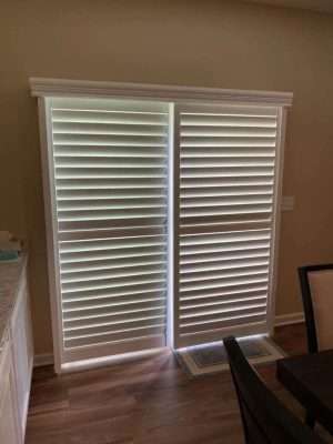 White plantation shutters in a home interior.