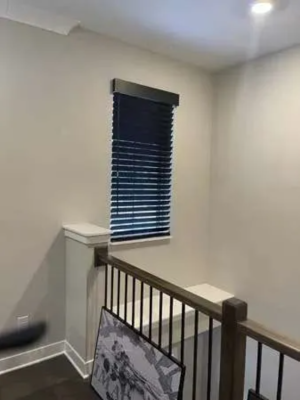 Wood Blinds covering large window with natural light