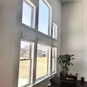 Drapery Fabric Roman Shades providing filtered light in room