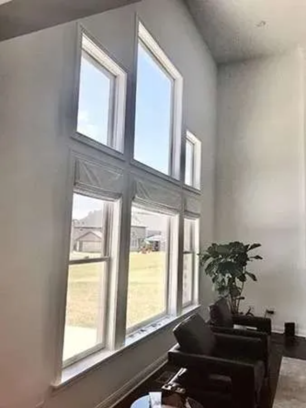 Drapery Fabric Roman Shades providing filtered light in room