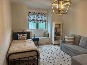 Cozy modern bedroom interior with furniture and decor.