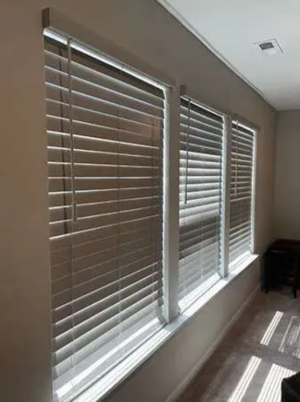Cordless Faux Wood Blinds installed in a bright living room